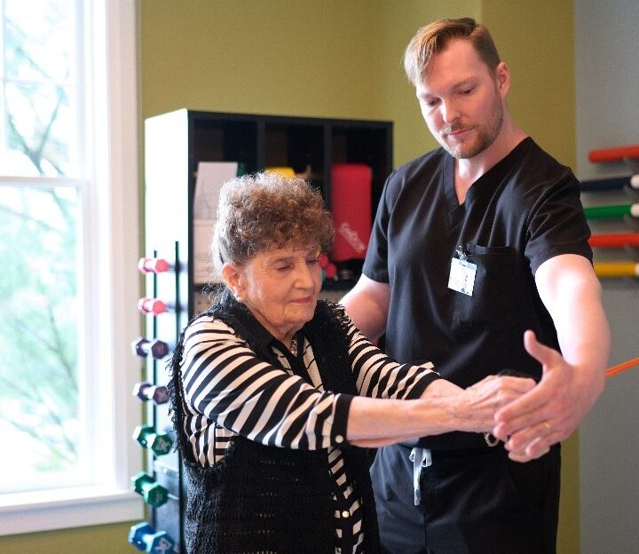 Physical therapist works with a patient
