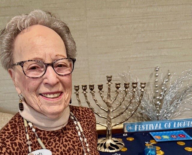 Meadow Ridge Resident Beulah Schwaeber with menorah